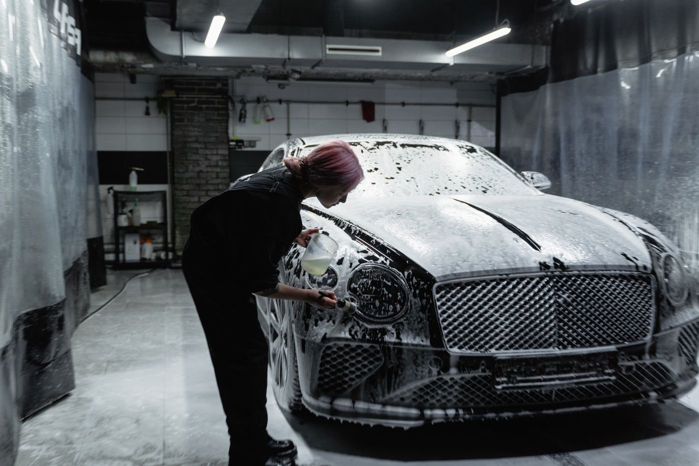 Car covered in foam during a mobile wash